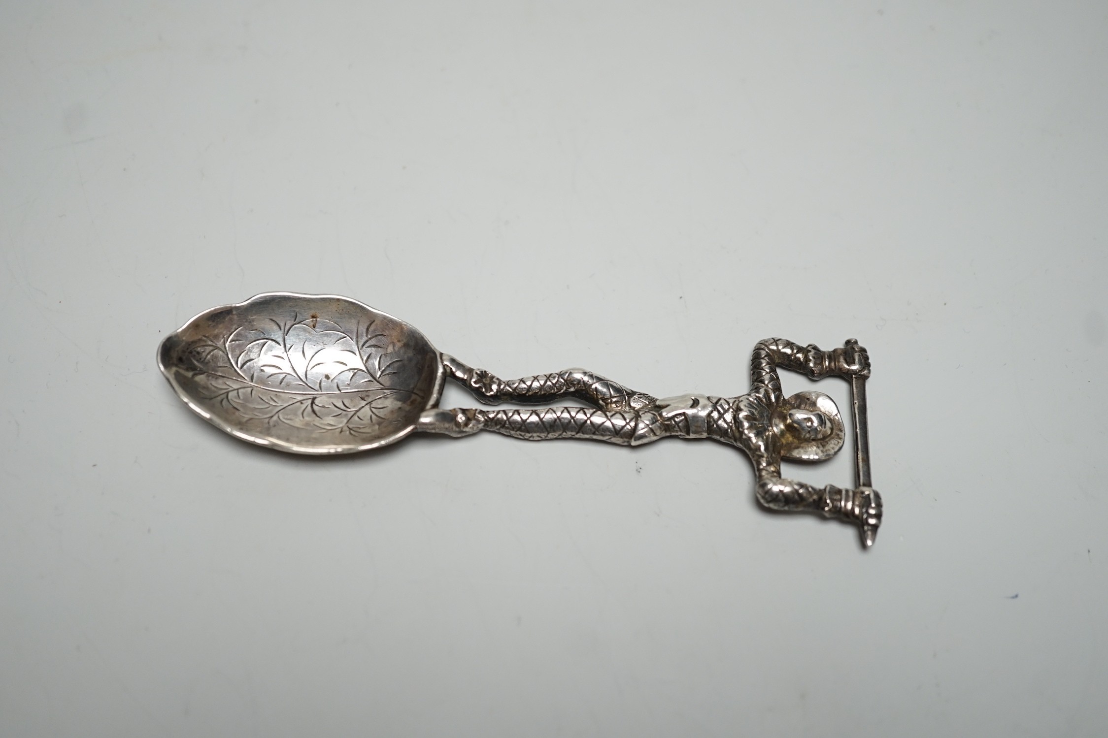 An early Victorian novelty silver caddy? spoon, with figural stem, Susanna Cook, London, 1845, 11.6cm.
